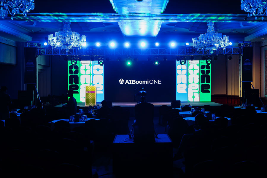 The AIBoomi ONE main stage lit up before a session