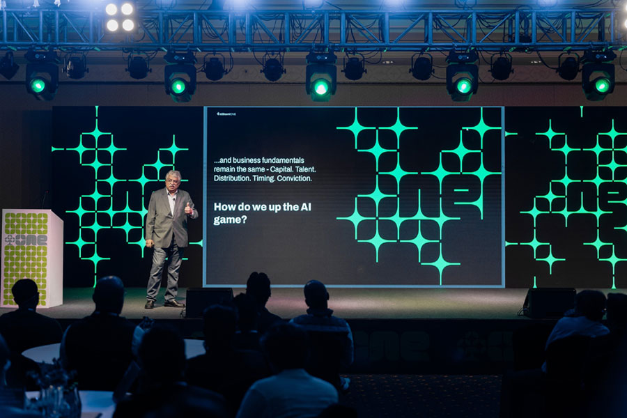 A speaker on stage addressing the audience